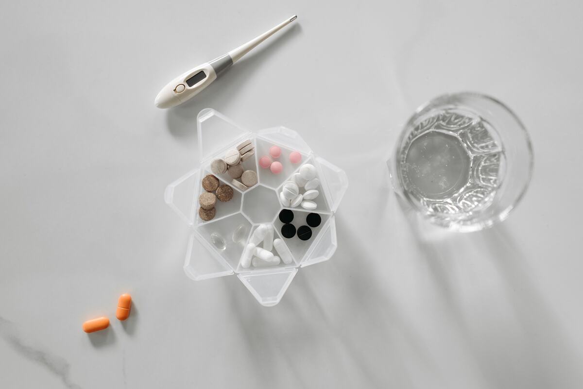 A weekly pill organizer with medications sorted by day
